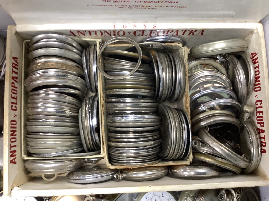 A group of assorted base metal pocket and fob watches including Longines and a quantity of accessories including movements and bezels.